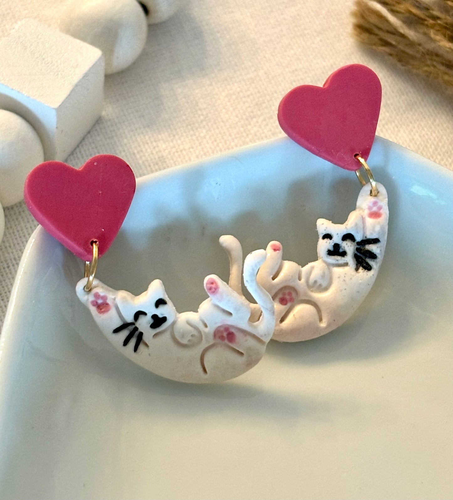 Hanging cats with hearts