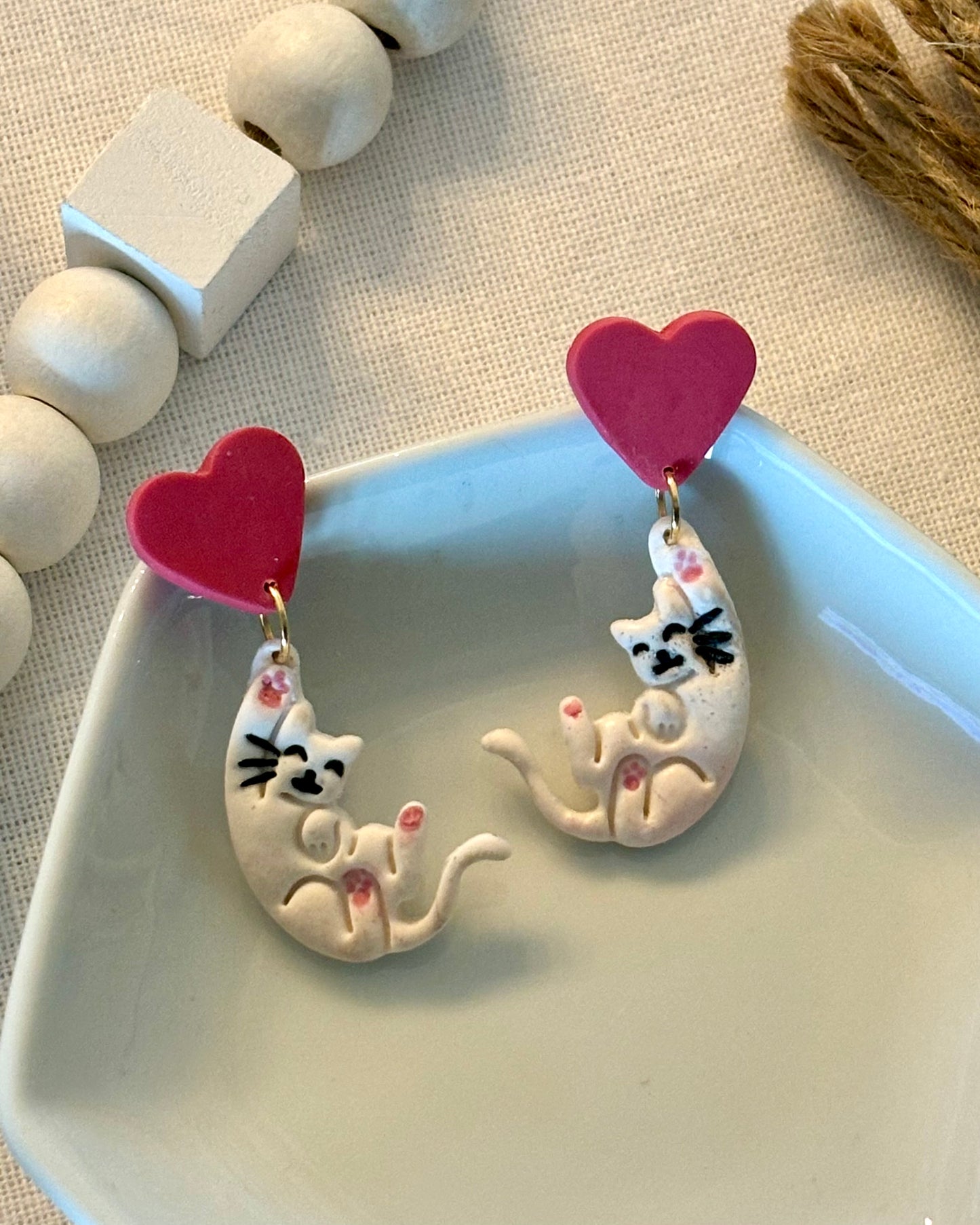 Hanging cats with hearts